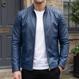 Men's blue faux leather biker jacket with quilted shoulders, front lifestyle view