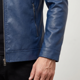 Men's blue faux leather biker jacket with quilted shoulders, cuff and side pocket detail
