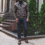 Men's distressed gray-brown faux leather jacket, full-length lifestyle view