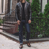 Men's black faux leather coat, street lifestyle view