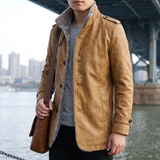 Men's earthy yellow faux leather coat, lifestyle view with shoulder bag