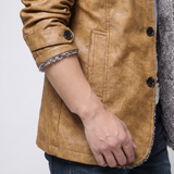Men's earthy yellow faux leather coat, cuff and pocket detail