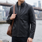 Men's black stand-collar faux leather zip jacket, lifestyle view with shoulder bag