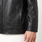 Men's black turn-down-collar faux leather zip jacket, cuff and side pocket detail