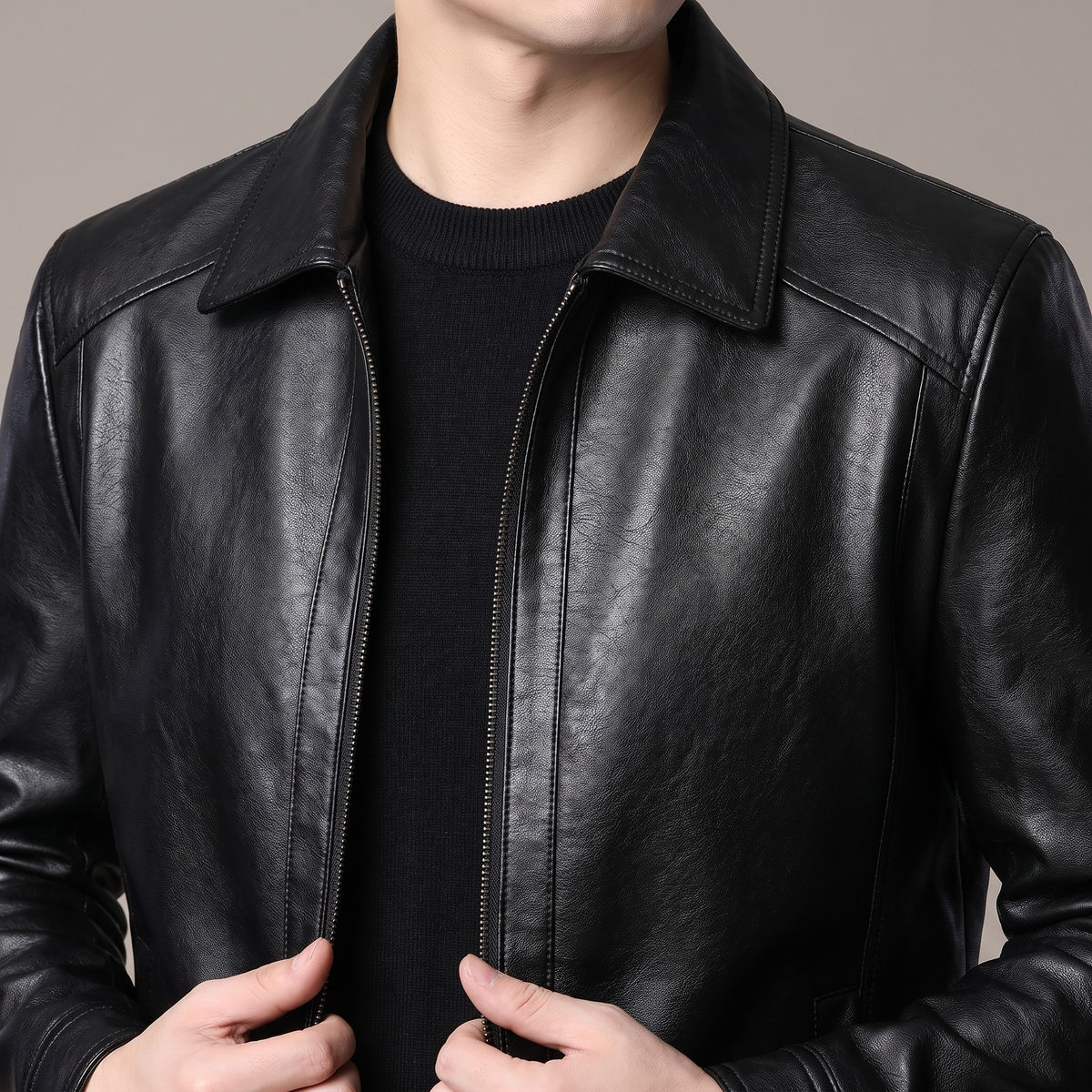 Men's black turn-down-collar faux leather zip jacket, collar and shoulder detail