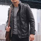 Men's black faux leather coat, lifestyle view with shoulder bag