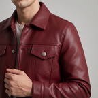 Men's burgundy button-front faux leather trucker jacket, collar and chest detail