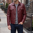 Men's burgundy button-front faux leather trucker jacket, street lifestyle view