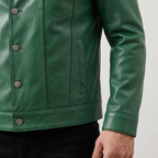 Men's green button-front faux leather trucker jacket, cuff and hem detail