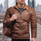Men's earthy brown quilted-shoulder faux leather moto jacket, lifestyle view with shoulder bag