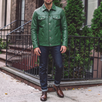 Men's green button-front faux leather trucker jacket, street lifestyle view
