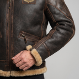 Men's brown faux leather aviator jacket with plush trim, cuff detail