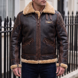 Men's brown faux leather aviator jacket with plush trim, street lifestyle view