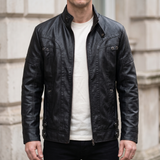 Men's black faux leather jacket with eyelet details, front lifestyle view