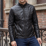 Men's black faux leather jacket with eyelet details, street lifestyle view