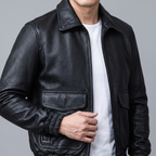 Men's black leather A2 flight jacket, cuff and pocket detail