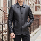 Men's black sheepskin leather button-front jacket, street lifestyle view