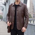 Men's brown sheepskin leather button-front jacket, lifestyle view with shoulder bag