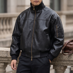 Men's black textured faux leather bomber jacket, three-quarter lifestyle view