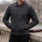 Men's black matte faux leather zip jacket, three-quarter lifestyle view