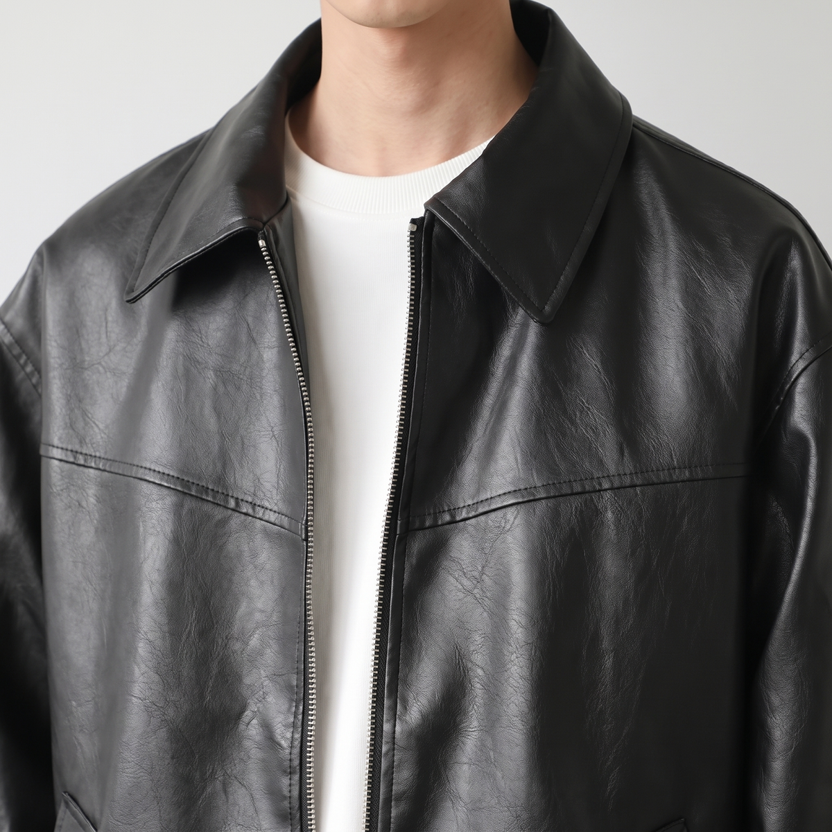 Men's black relaxed faux leather bomber jacket, collar detail