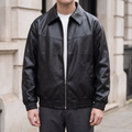 Men's black relaxed faux leather bomber jacket, front lifestyle view