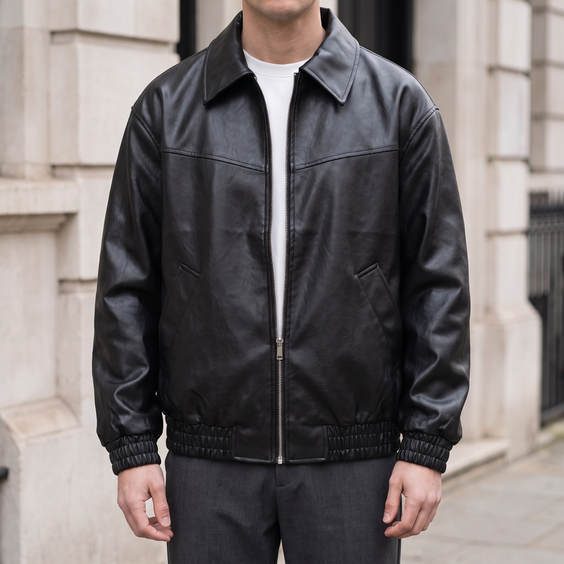 Men's black relaxed faux leather bomber jacket, front lifestyle view