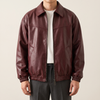 Men's wine red relaxed faux leather bomber jacket, studio front view