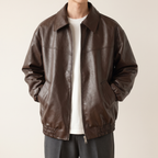Men's brown relaxed faux leather bomber jacket, studio front view