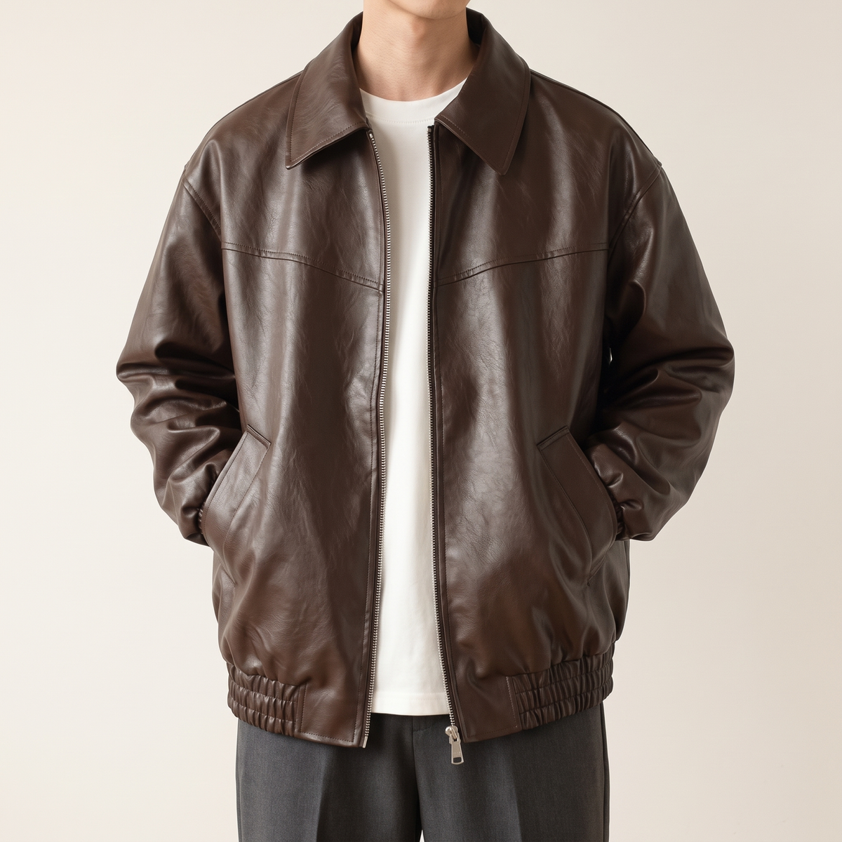 Men's brown relaxed faux leather bomber jacket, studio front view