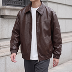 Men's brown relaxed faux leather bomber jacket, three-quarter lifestyle view