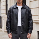 Men's black oversized faux leather jacket, front lifestyle view