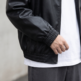 Men's black oversized faux leather jacket, gathered cuff detail