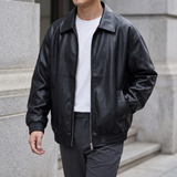 Men's black oversized faux leather jacket, three-quarter lifestyle view