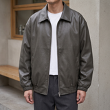 Men's grey oversized faux leather jacket, street lifestyle view