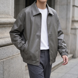 Men's grey oversized faux leather jacket, three-quarter lifestyle view
