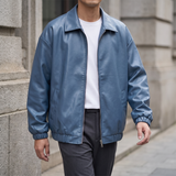 Men's blue oversized faux leather jacket, three-quarter lifestyle view