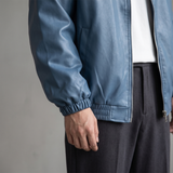 Men's blue oversized faux leather jacket, gathered cuff detail