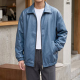 Men's blue oversized faux leather jacket, street lifestyle view