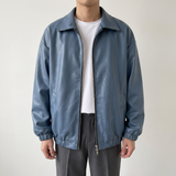 Men's blue oversized faux leather jacket, studio front view