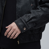 Men's black snake-pattern faux leather bomber jacket, cuff detail