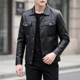 Men's black slim faux leather trucker jacket, walking lifestyle view