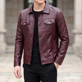 Men's burgundy slim faux leather trucker jacket, three-quarter lifestyle view