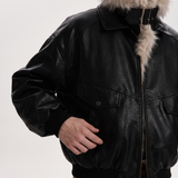 Men's black faux leather aviator jacket with faux fur collar, cuff detail