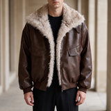 Men's brown faux leather aviator jacket with faux fur collar, three-quarter lifestyle view