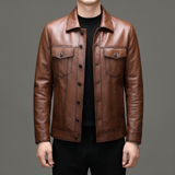 Men's brown cowhide leather trucker jacket, studio view