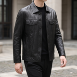 Men's black cowhide leather trucker jacket, walking lifestyle view