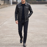 Men's black faux leather trucker jacket, full-body lifestyle