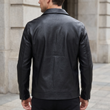 Men's black faux leather trucker jacket, rear on model