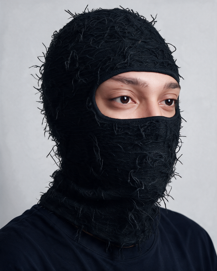 Black distressed knit balaclava worn portrait